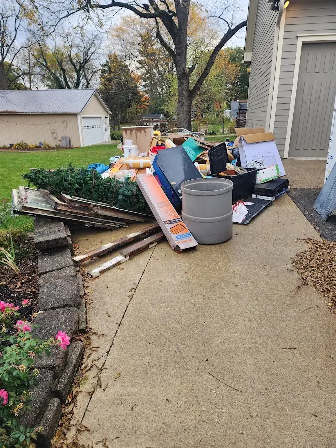 Dumpster being loaded with debris for 3 Yard Dumpster Rental in Cynthiana